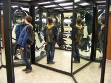 Man in house of mirrors at a funfair