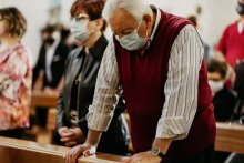 Man in church service wearing a mask