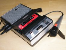 Cassette tape recorder and microphone.