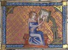 Medieval scribe writing at a desk